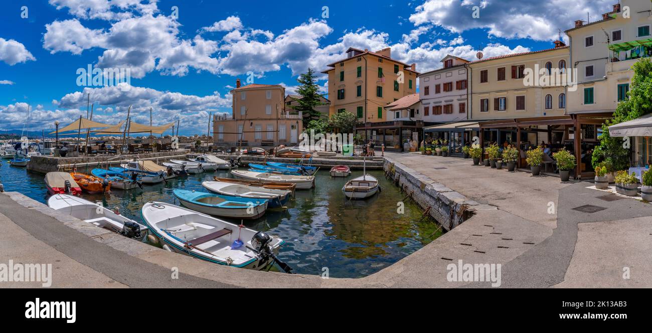 View of restaurants and cafes overlooking marina at Volosko, Kvarner Bay, Eastern Istria, Croatia, Europe Stock Photo