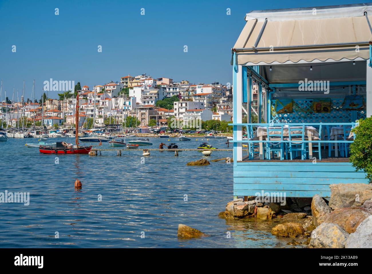View of boats and Skiathos Town, Skiathos Island, Sporades Islands, Greek Islands, Greece, Europe Stock Photo