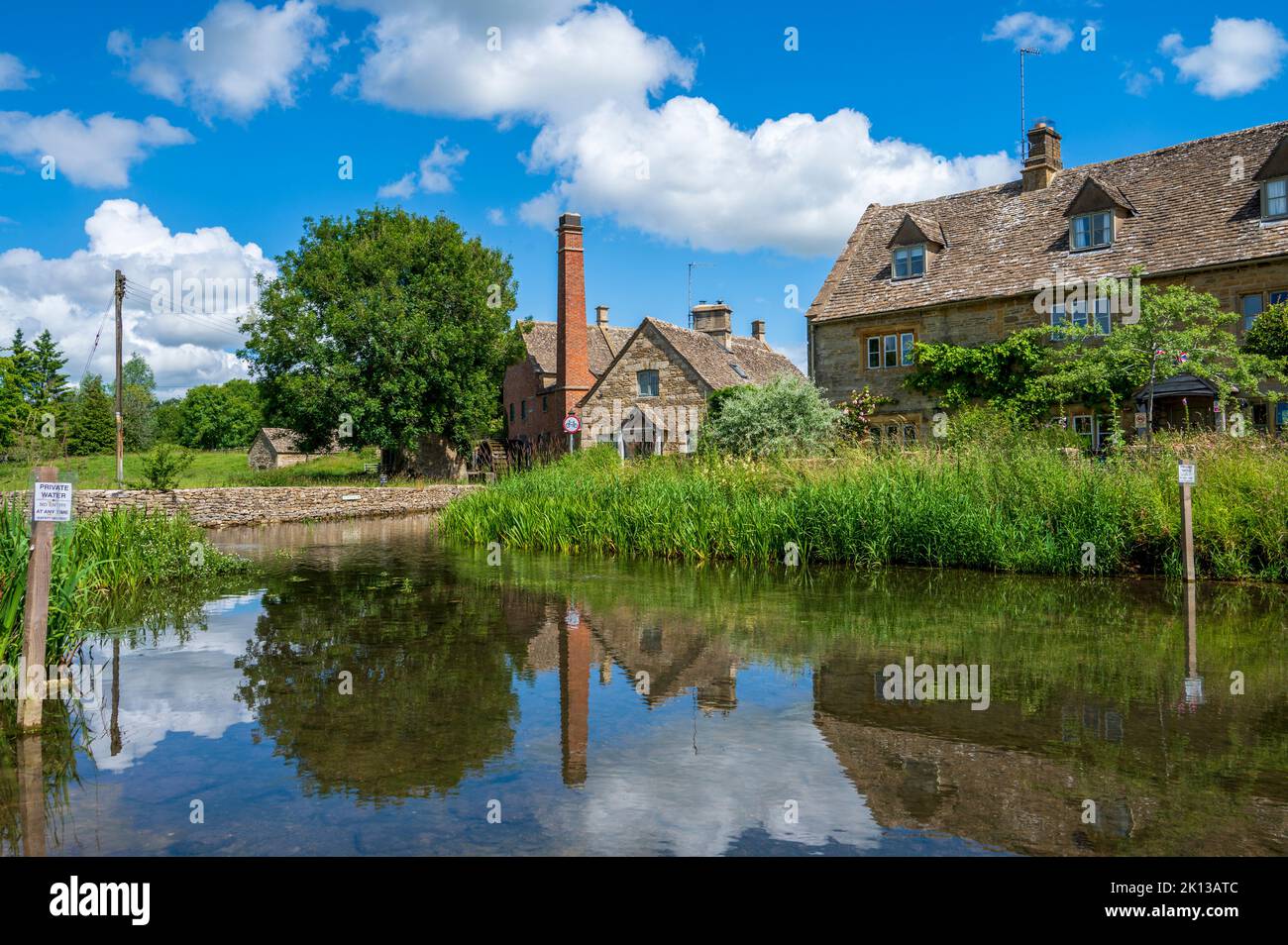 Mill and cottages on River Eye, Lower Slaughter, Cotswolds, Gloucestershire, England, United Kingdom, Europe Stock Photo