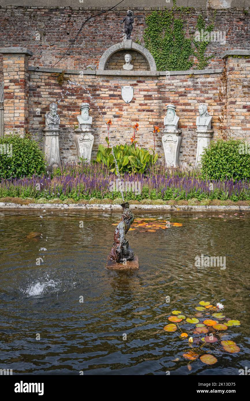 Wicklow, Ireland, Aug 2019 Triton statue and fountain on a small pond