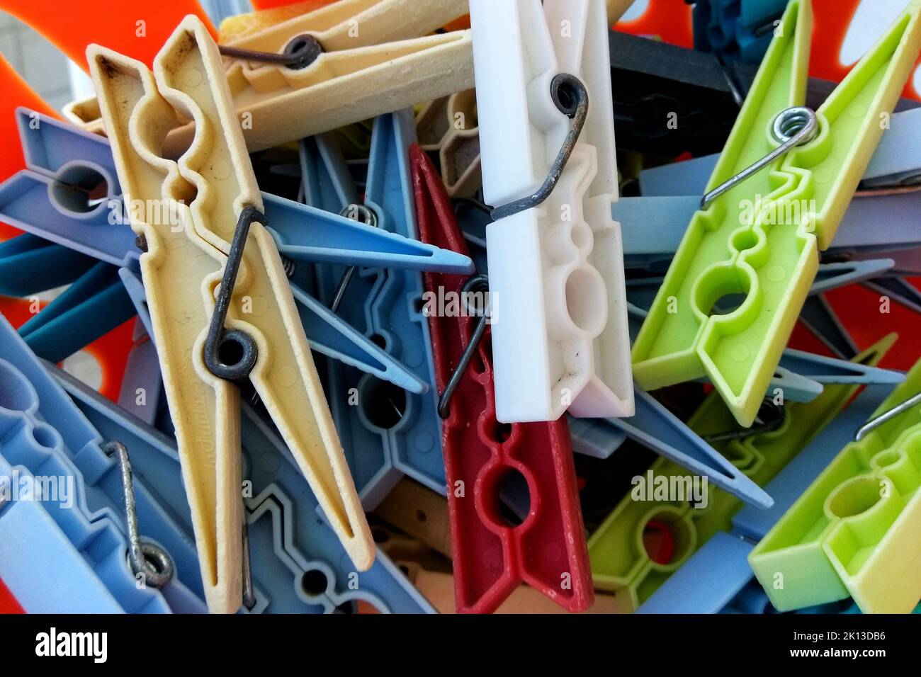 colorful plastic clothes pegs in a tray Stock Photo Alamy
