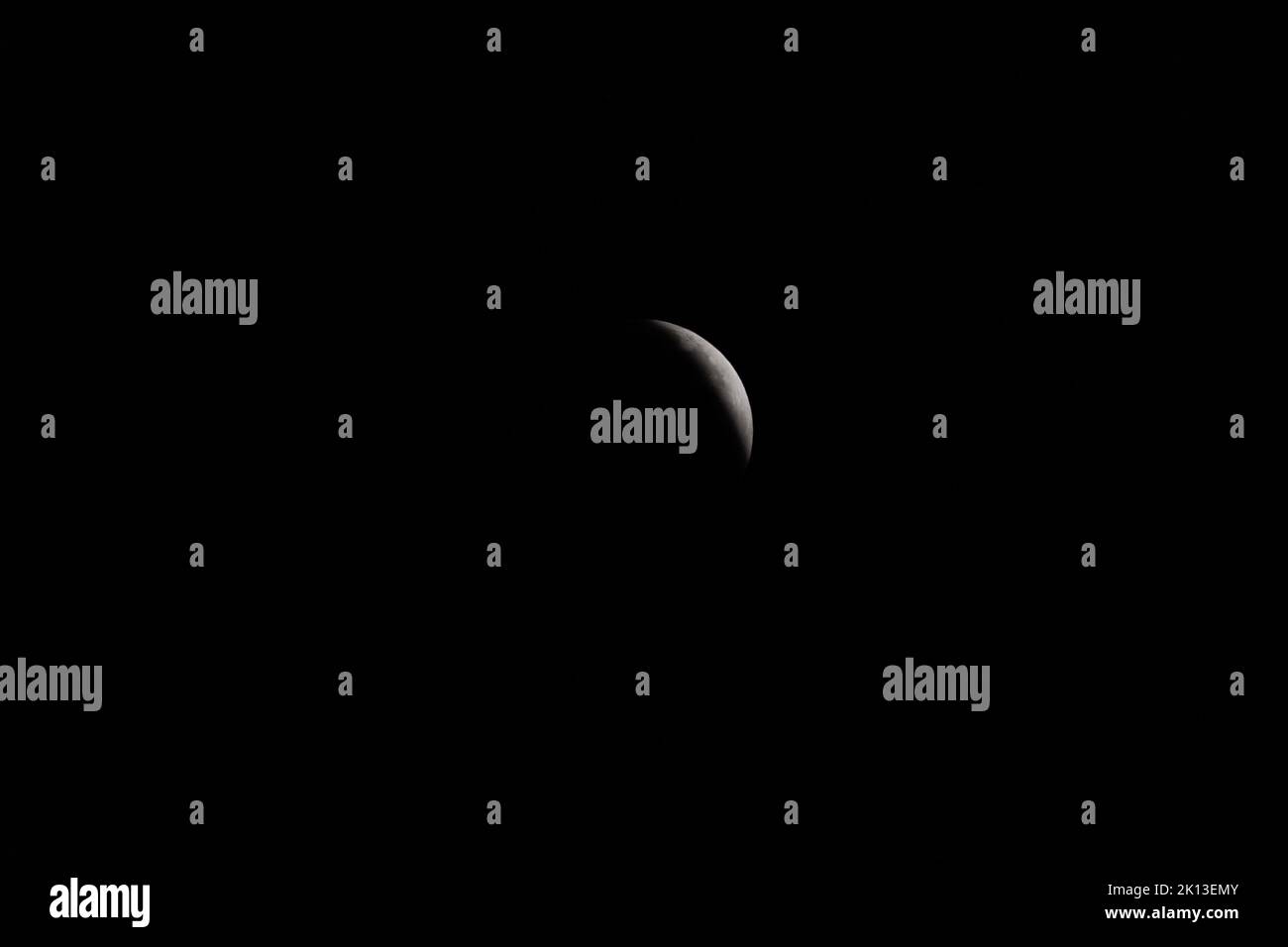 Solar Eclipse Rising The lunar eclipse full crescent super moon rising against the dark sky ...