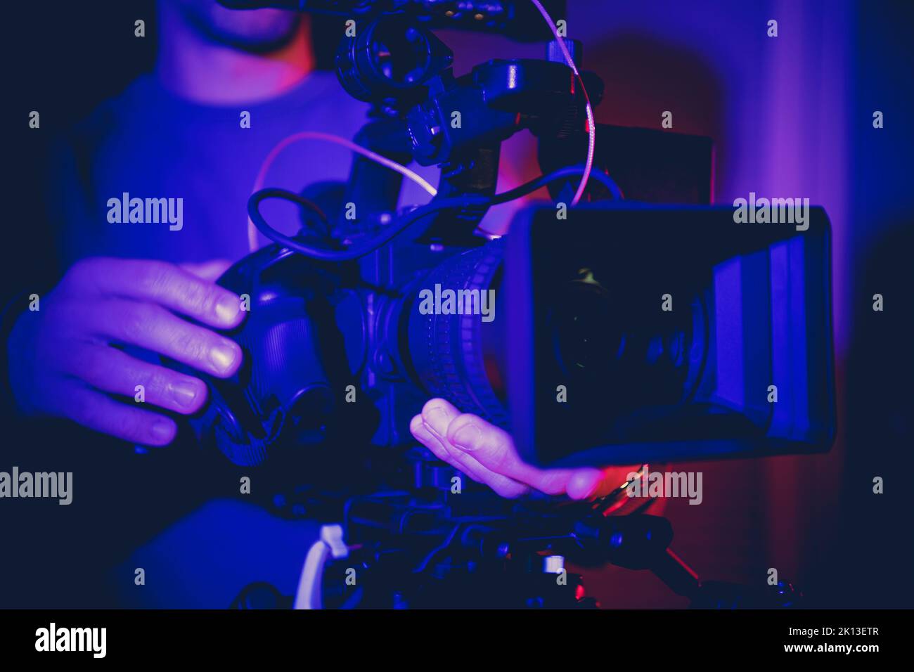 Profession Digital Motion Picture Video Camera in Operators Hands