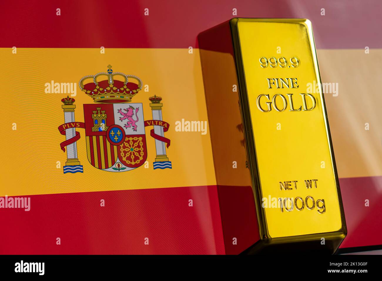 The gold bar is on the national flag of spain, spanish Gold Reserve concept Stock Photo