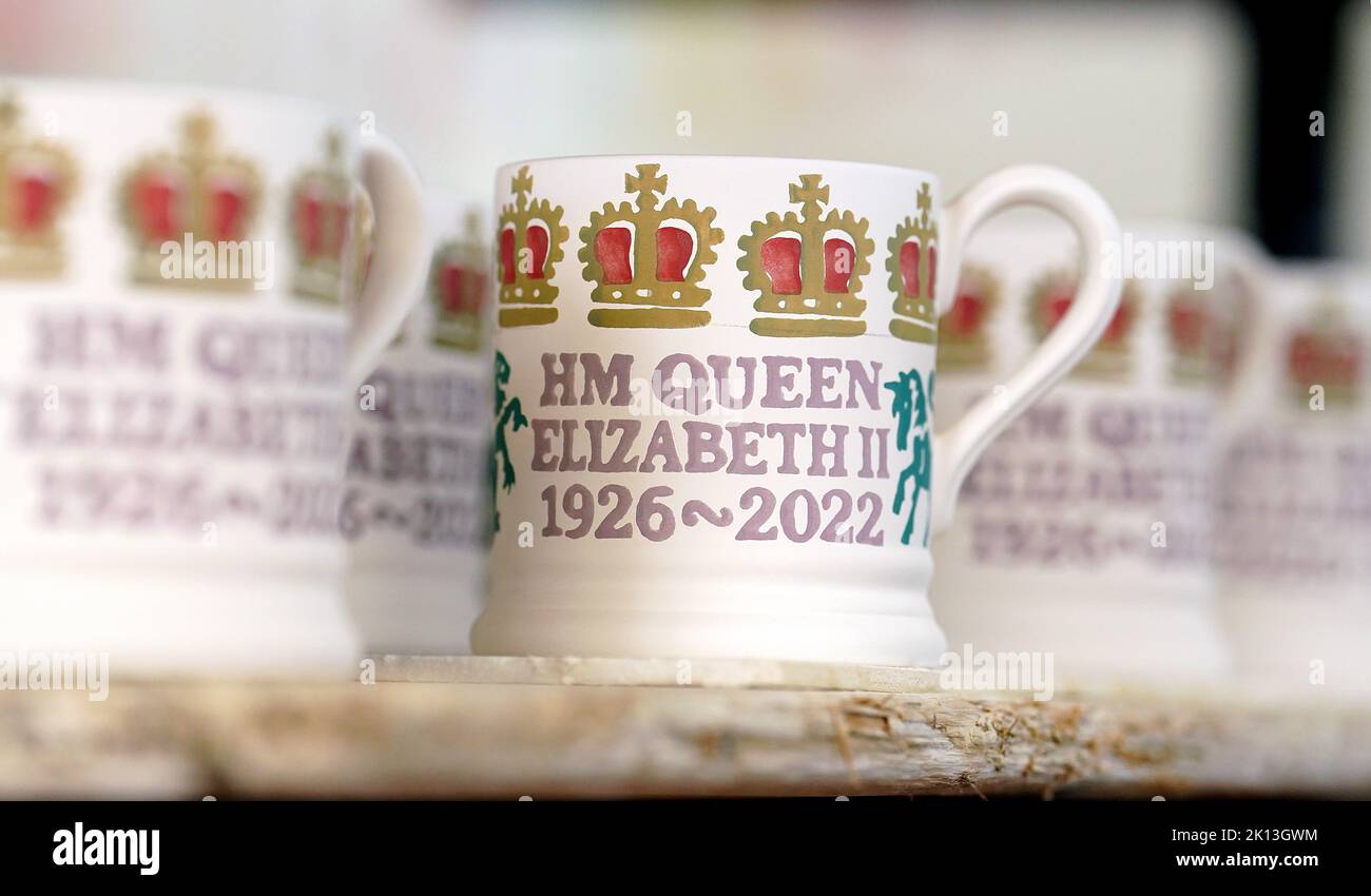 Commemorative mugs stand ready for the kiln at Emma Bridgewater pottery