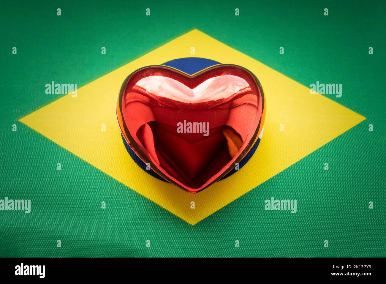 The red heart is on the flag of Brazil. The concept of patriotic feelings for one's state. Patriotism Stock Photo