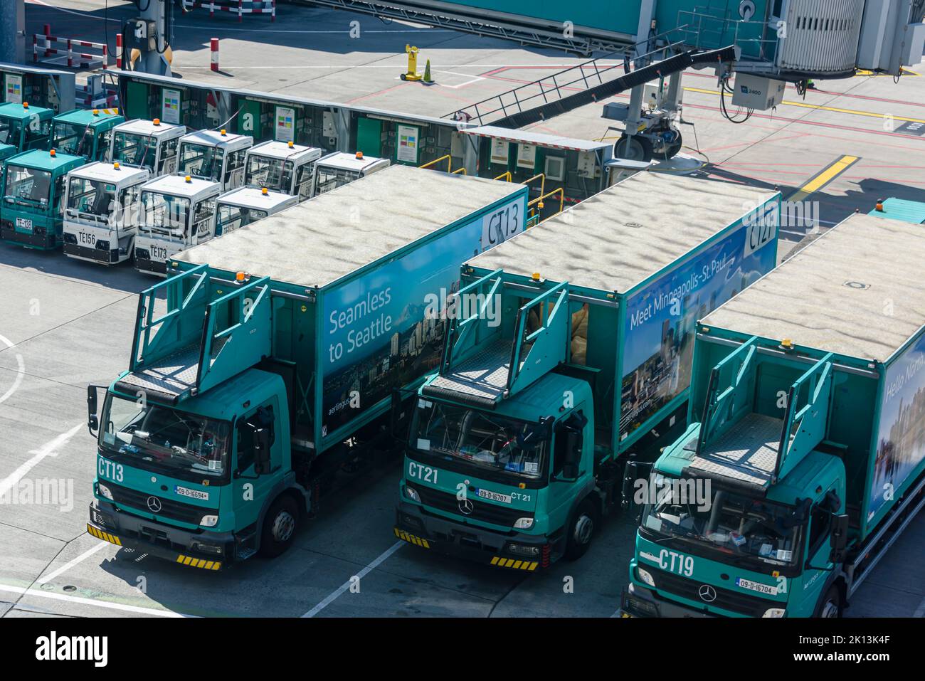 Catering and baggage trucks parked up on the apron at Dublin Airport, Ireland Stock Photo