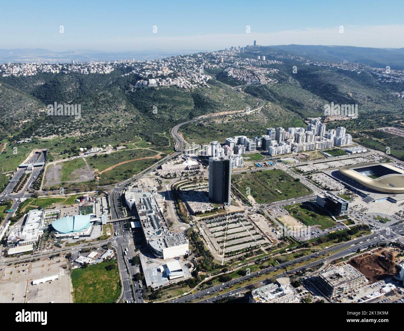 An aerial view of buildings on Har Hotzvim mountain peak and Jerusalem ...