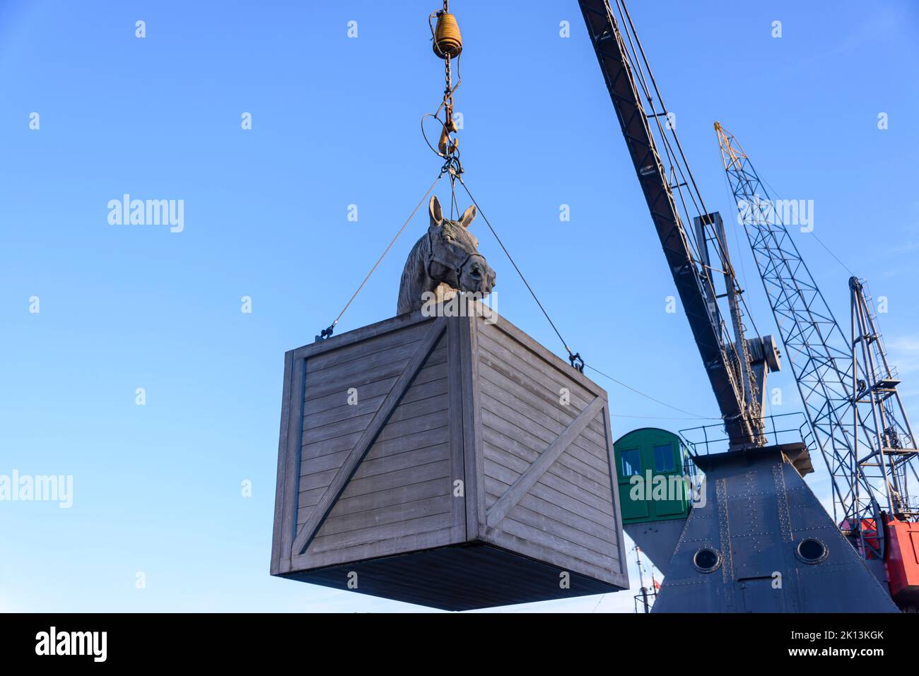 Crane holds a model of a crate containing a horse at the Port of Rotterdam, Netherlands Stock Photo