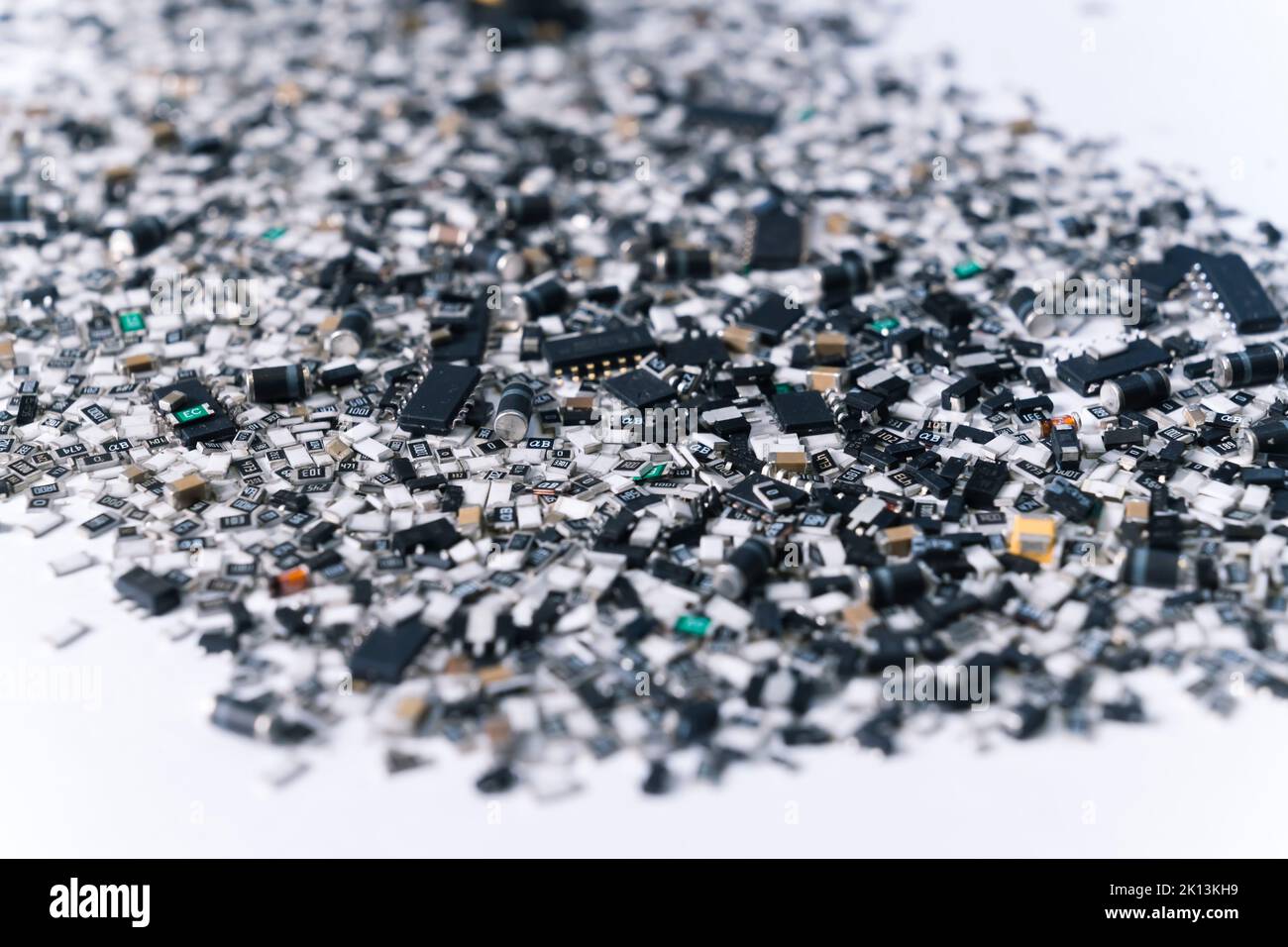 Various electrical components for circuit board mixed and scattered on white surface. Silver and black. Technology. Horizontal shot. High quality photo Stock Photo