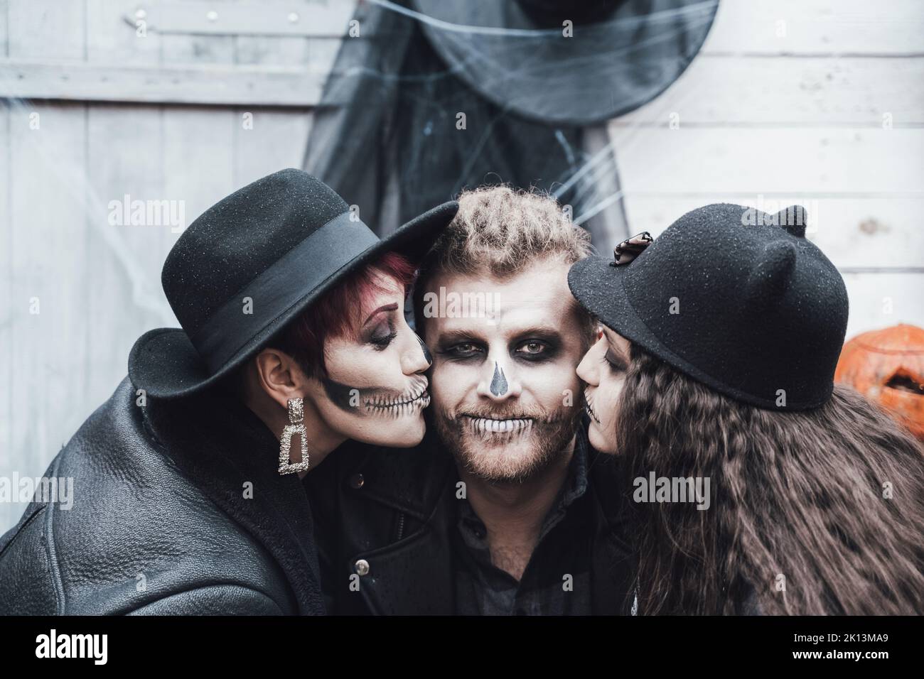 Scary family, mother, father, daughters celebrating halloween