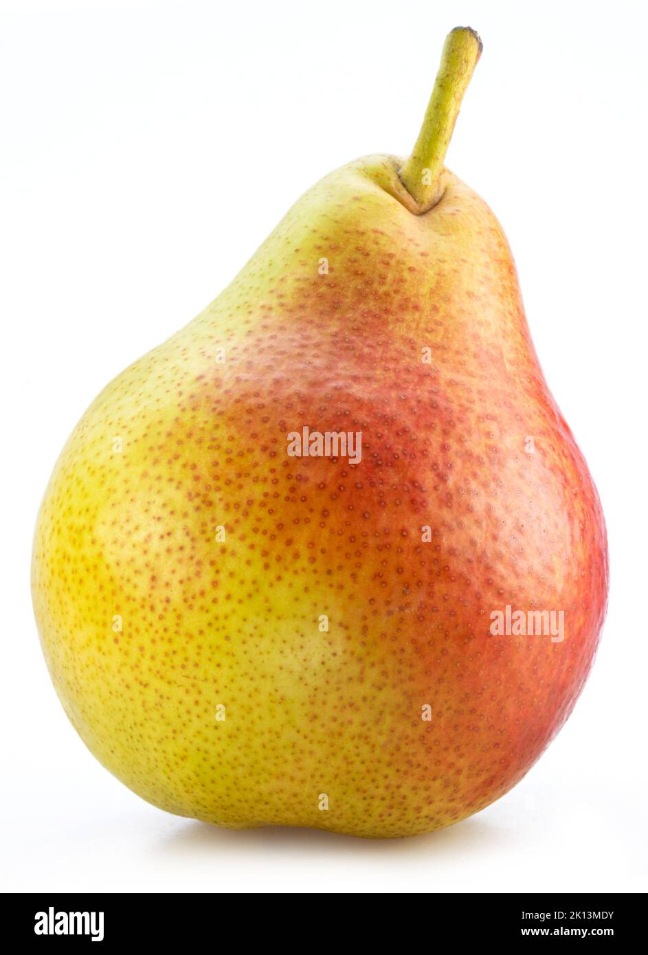 Ripe yellow pear with red side isolated on white background. Stock Photo