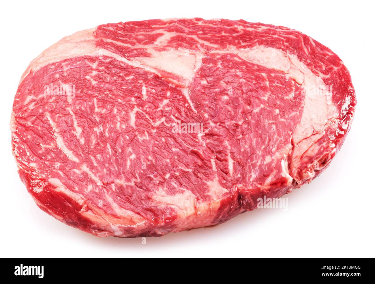 Raw ribeye steak isolated on white background. Top view. Macro. Stock Photo