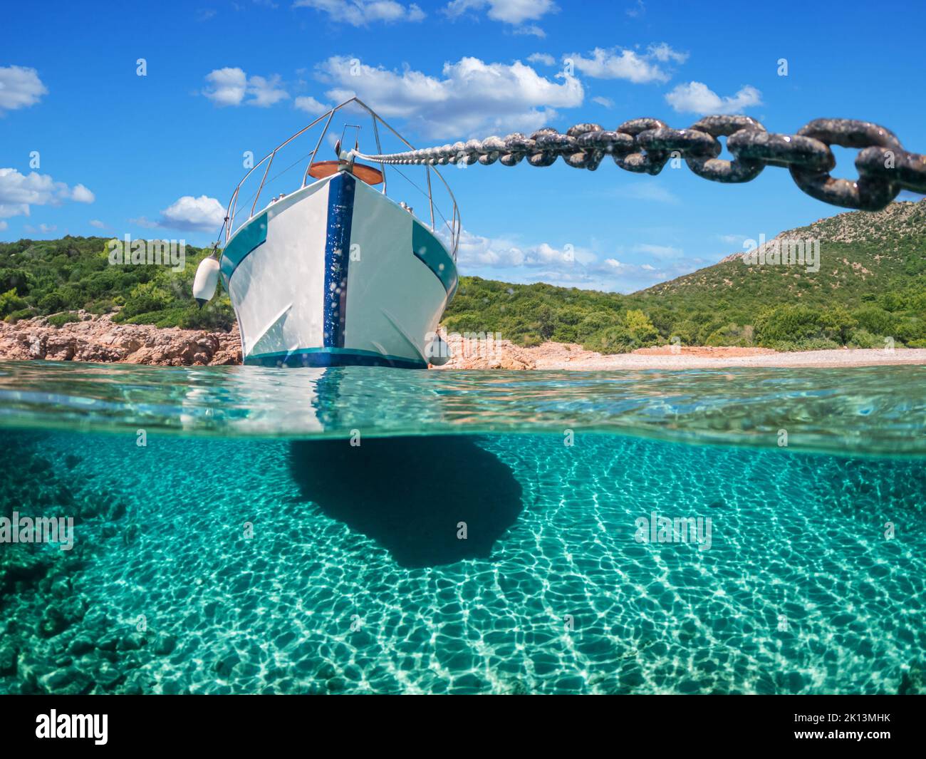 Split view - half underwater view of beautiful seabed with sea fishes and beautiful marine yacht, Turkey, Bodrum. Stock Photo