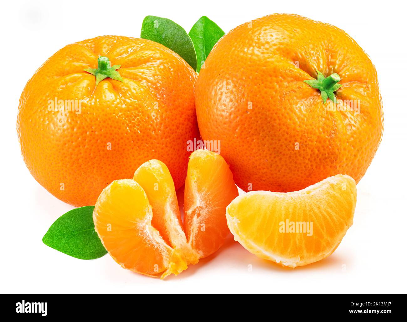 Ripe tangerine fruits with leaf and mandarin slices on white background. Stock Photo