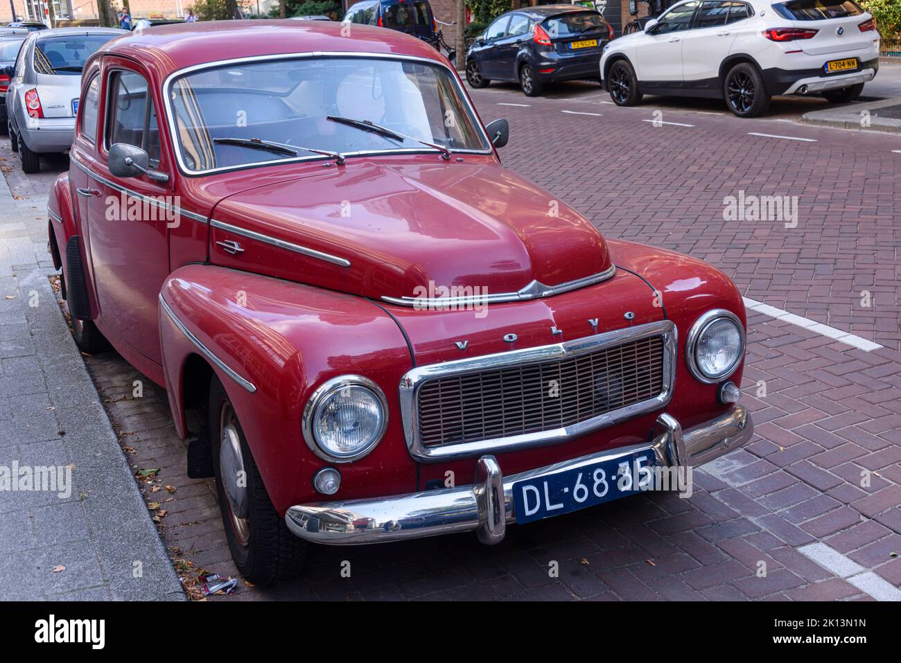 Red Volvo PV544 parked in Rotterdam, Netherlands Stock Photo