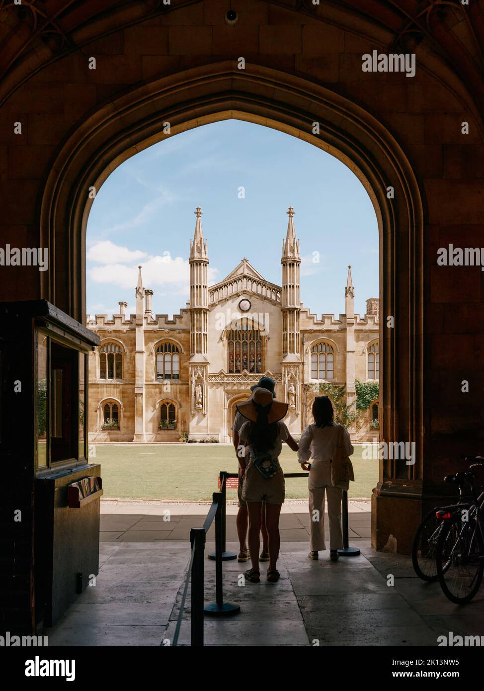 Summer tourists exploring Corpus Christi College, Cambridge, Cambridgeshire England UK - University of Cambridge summertime tourism Stock Photo