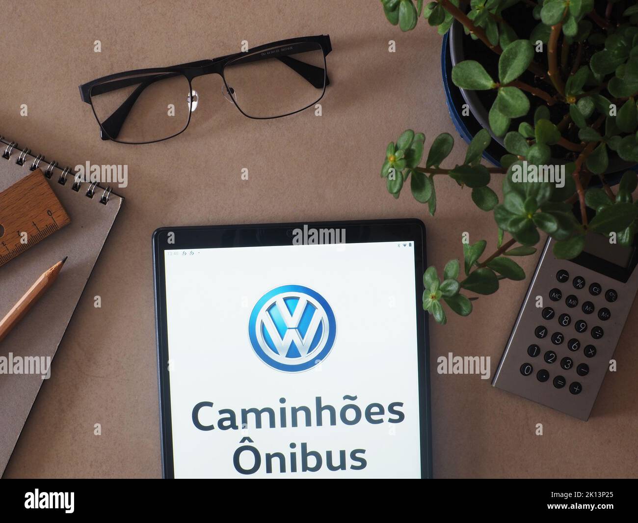 In this photo illustration, Volkswagen Caminhões e Ônibus brand of Traton Group logo seen displayed on a tablet Stock Photo