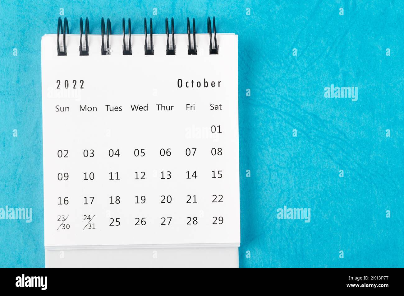 December 2022 Monthly desk calendar for 2022 year on blue background. Stock Photo