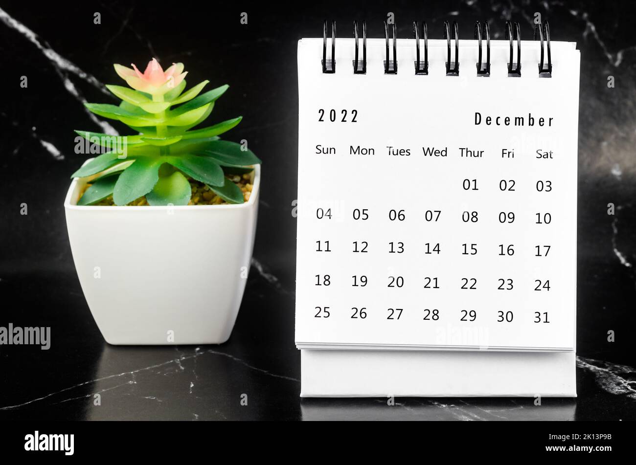 December 2022 Monthly desk calendar for 2022 year on black marble background. Stock Photo