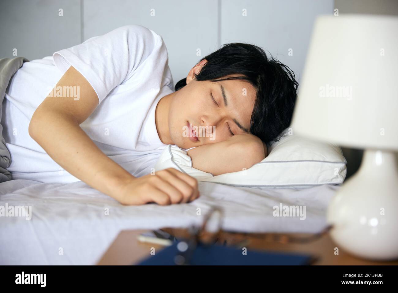 Japanese man in bed Stock Photo