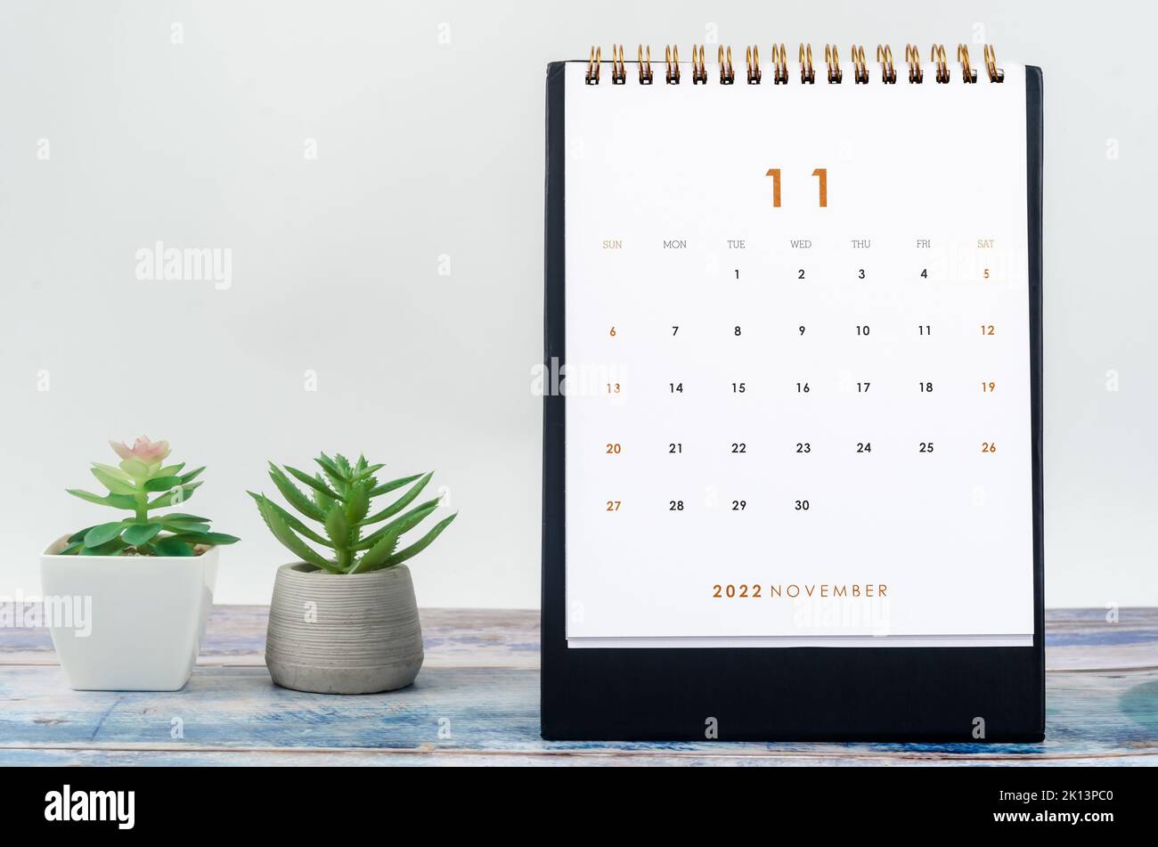 November 2022 Monthly desk calendar for 2022 year on old blue wooden ...