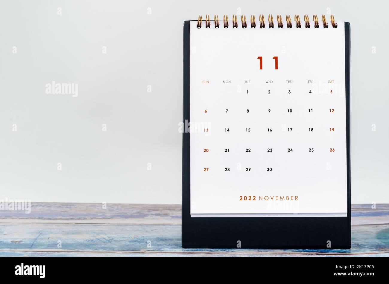 November 2022 Monthly desk calendar for 2022 year on old blue wooden background Stock Photo