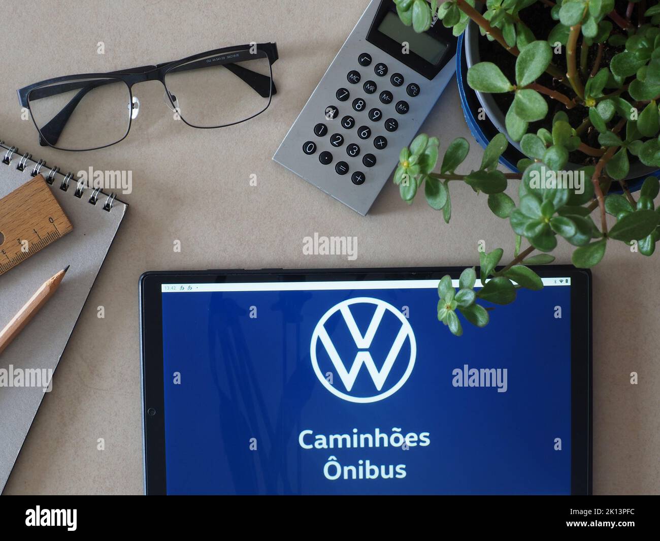 In this photo illustration, Volkswagen Caminhões e Ônibus brand of Traton Group logo seen displayed on a tablet Stock Photo