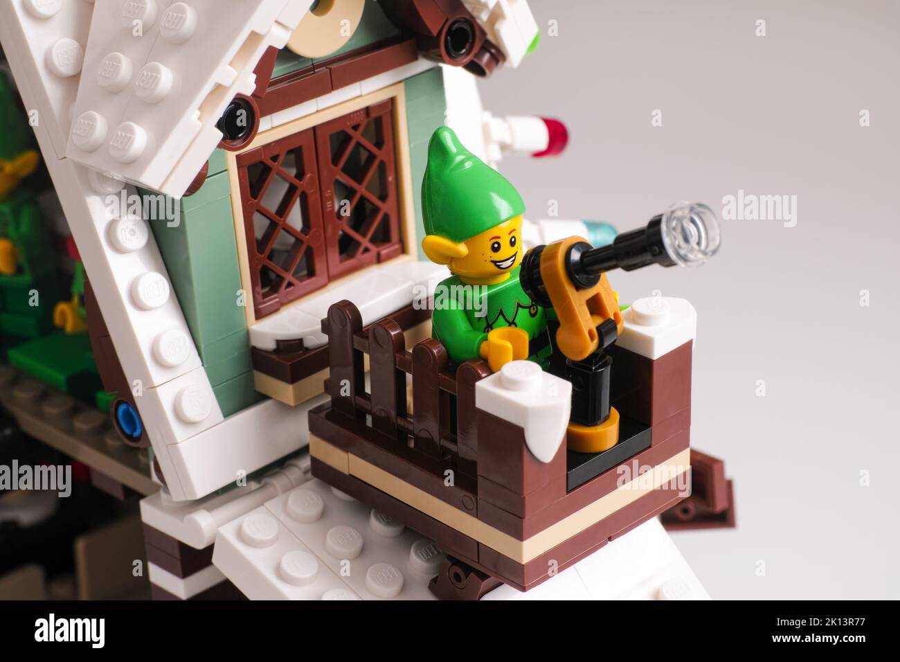 Tambov, Russian Federation - January 08, 2021 A close-up shot of a Lego Elf minifigure uses telescope on a balcony on rooftop Stock Photo