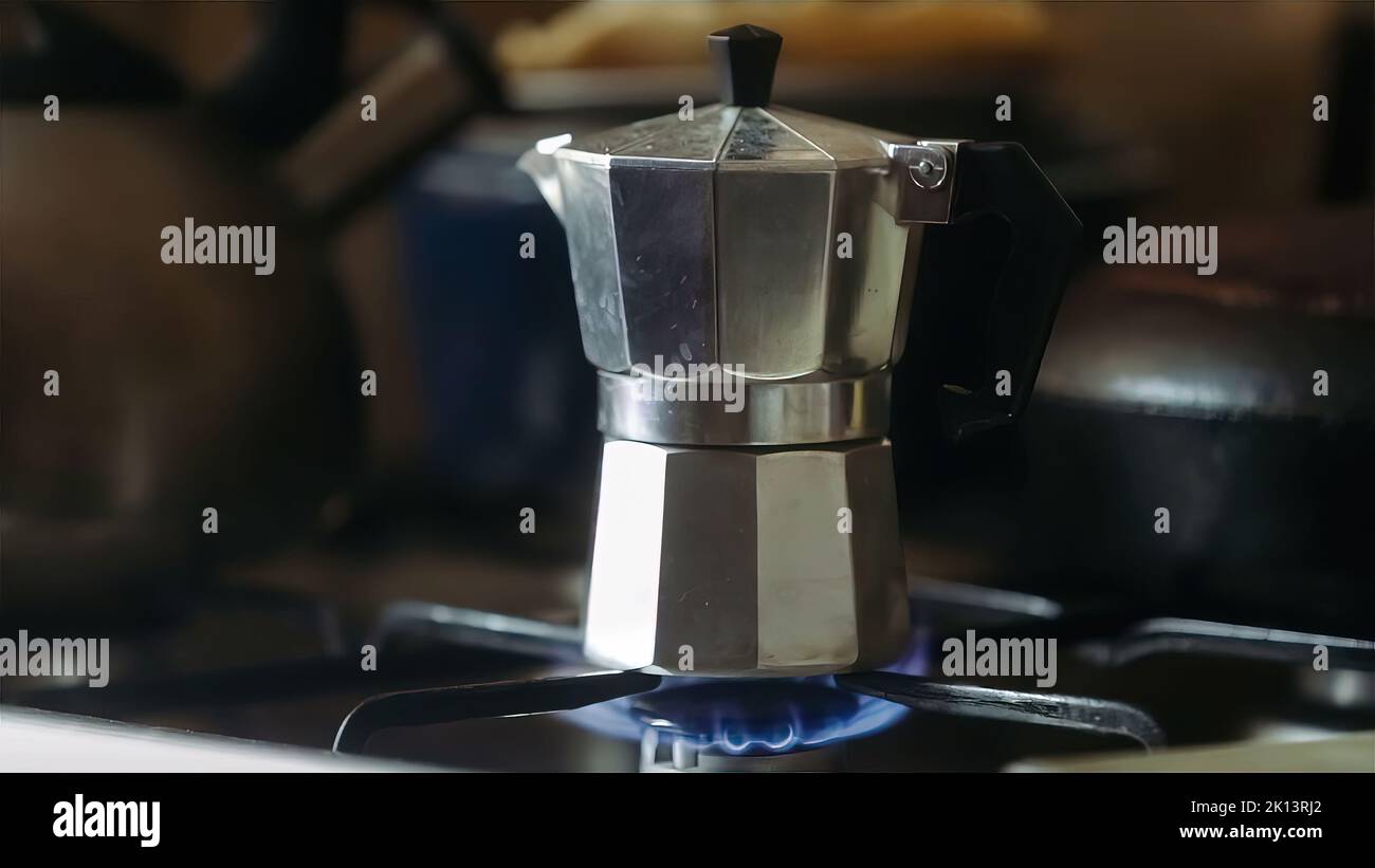 Moka pot brewing on a gas stove. Taditional way of brewing Italian