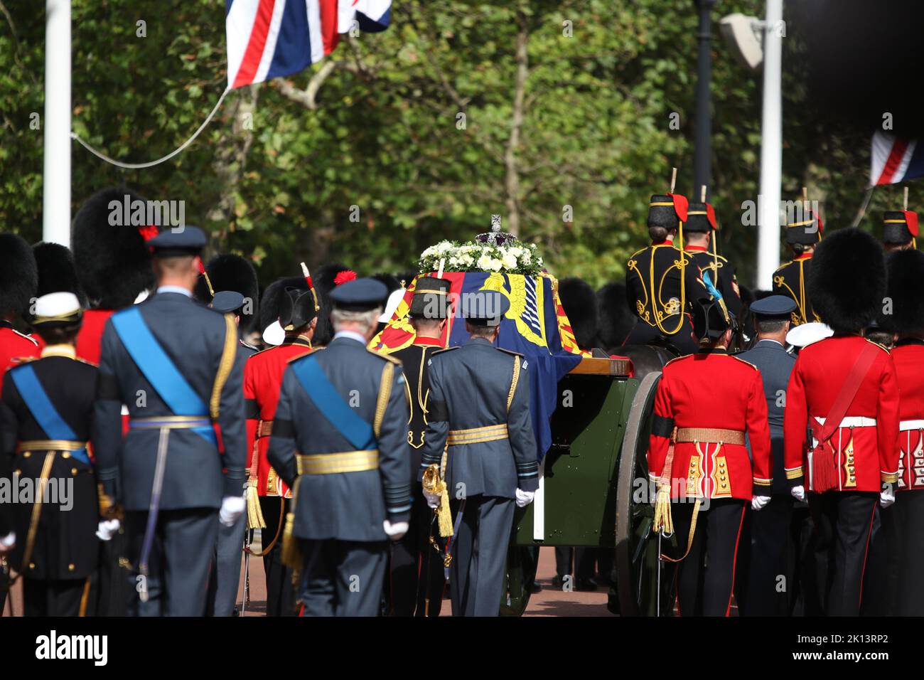 Queen Elizabeth the second is carried on a gun carriage from Buckingham
