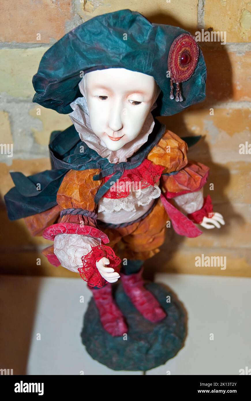 A collectible doll, which resembles a young pageboy, is on display at