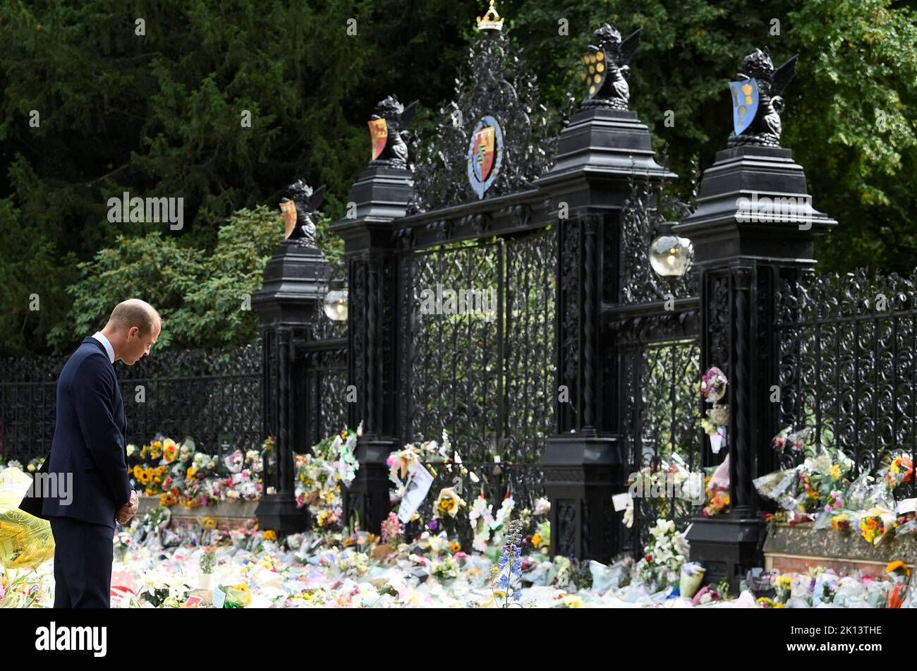 The Prince of Wales views floral tributes left by members of the public at the gates of Sandringham House in Norfolk, following the death of Queen Elizabeth II. Picture date: Thursday September 15, 2022. Stock Photo