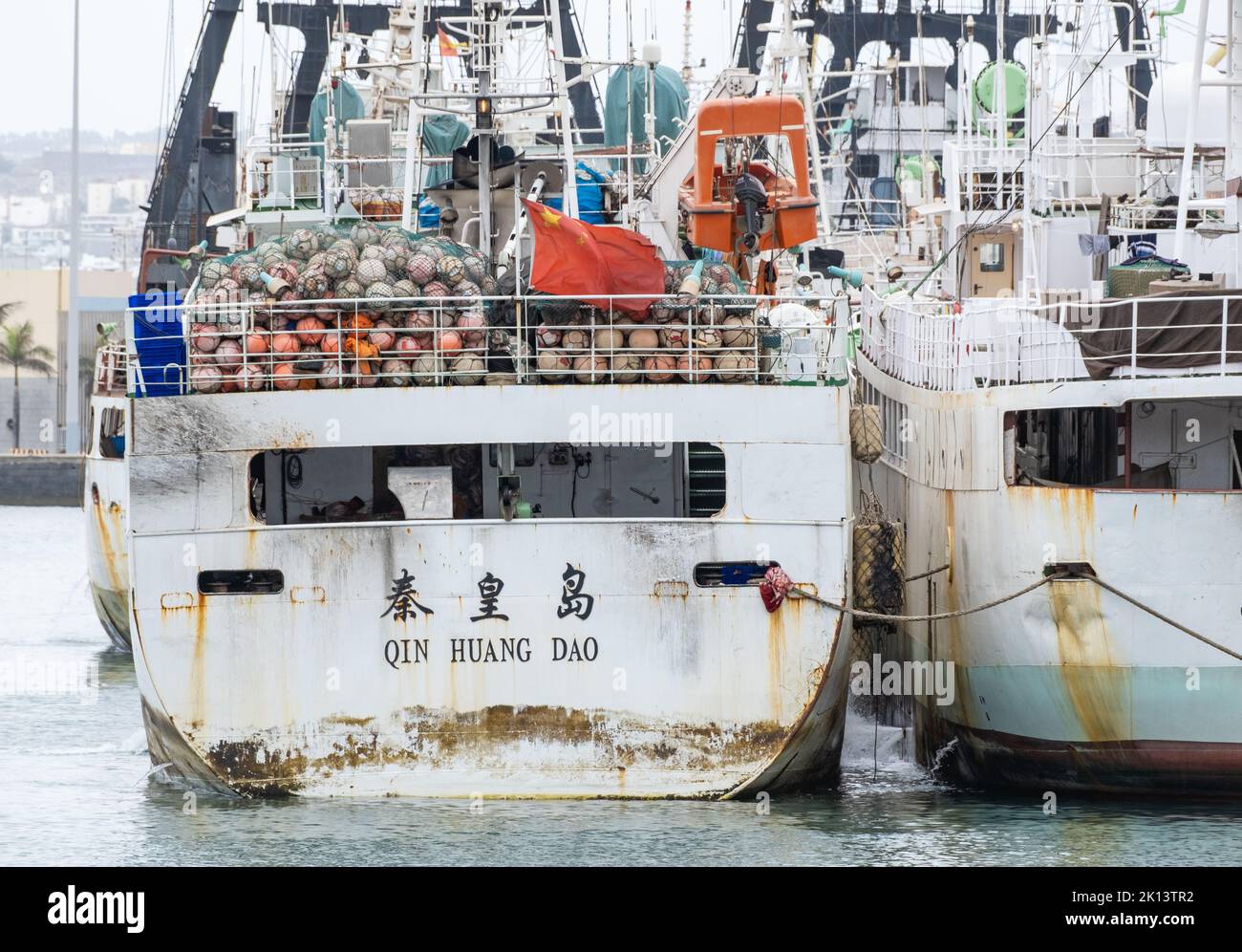 Chinese fishing trawlers in Atlantic Ocean fishing waters in Las Palmas port. Stock Photo