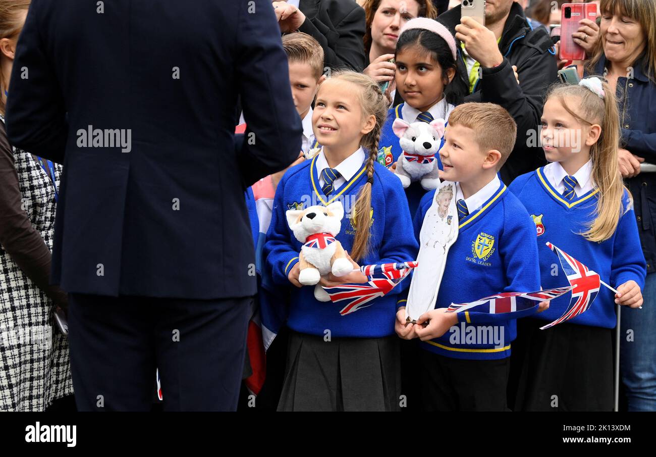 The Prince of Wales meeting students from Howard Junior School in King's Lynn as he views floral tributes left by members of the public at the gates of Sandringham House in Norfolk, following the death of Queen Elizabeth II. Picture date: Thursday September 15, 2022. Stock Photo