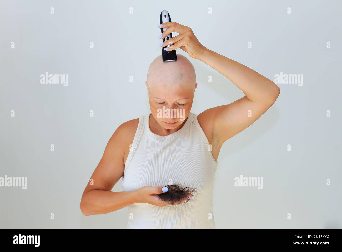 consequences of chemotherapy. Shaving off the last hair on the head