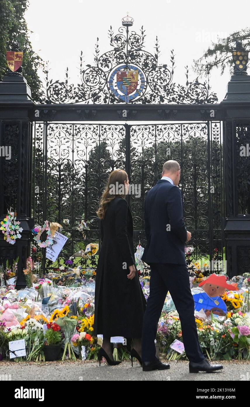 The Prince and Princess of Wales view floral tributes left by members of the public at the gates of Sandringham House in Norfolk, following the death of Queen Elizabeth II. Picture date: Thursday September 15, 2022. Stock Photo