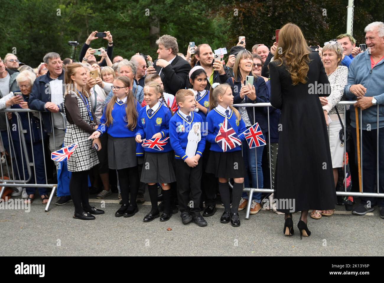 The Princess of Wales meeting students from Howard Junior School in King's Lynn as she views floral tributes left by members of the public at the gates of Sandringham House in Norfolk, following the death of Queen Elizabeth II. Picture date: Thursday September 15, 2022. Stock Photo