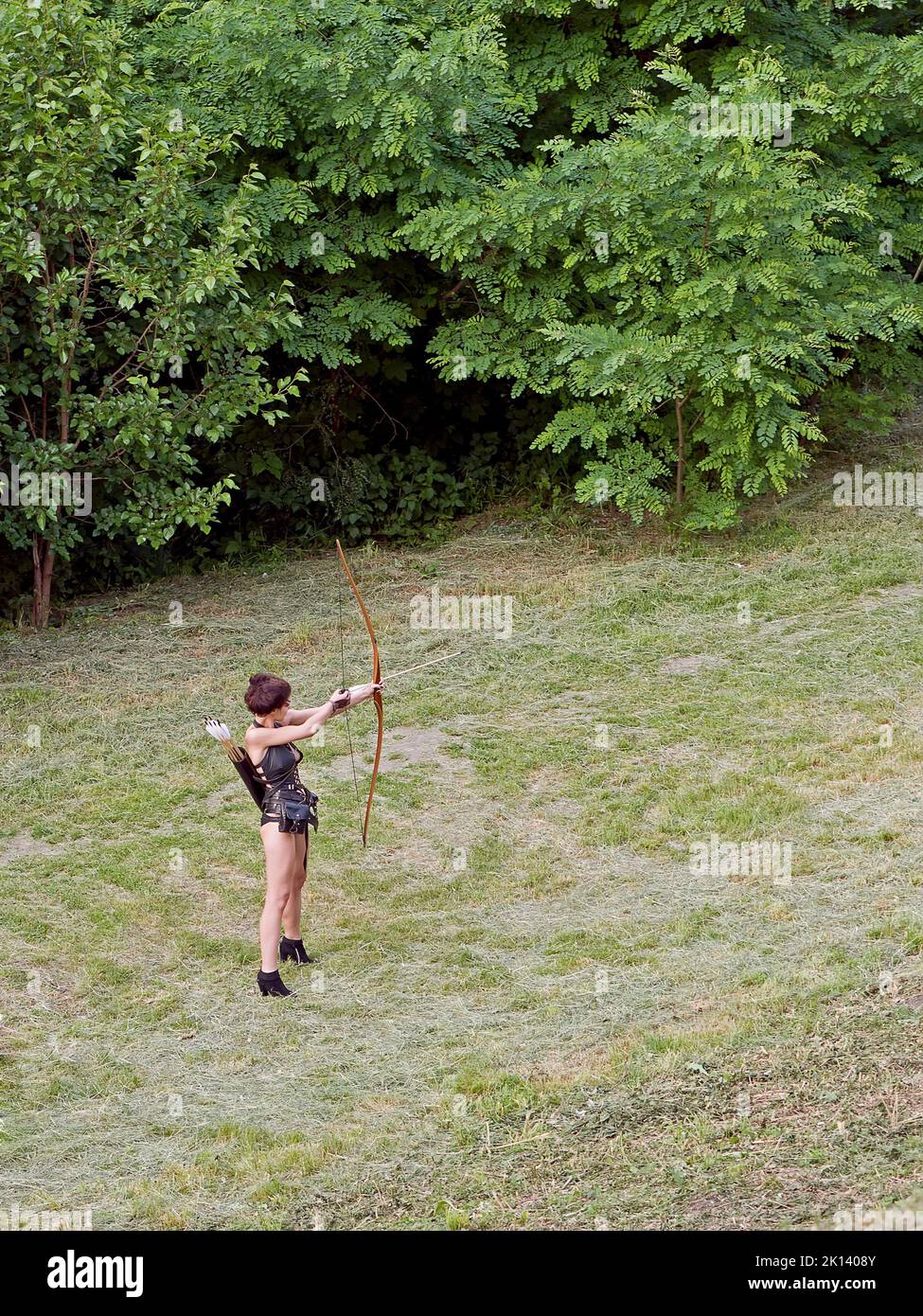 A player of the role-playing game representing a young archer woman Stock Photo