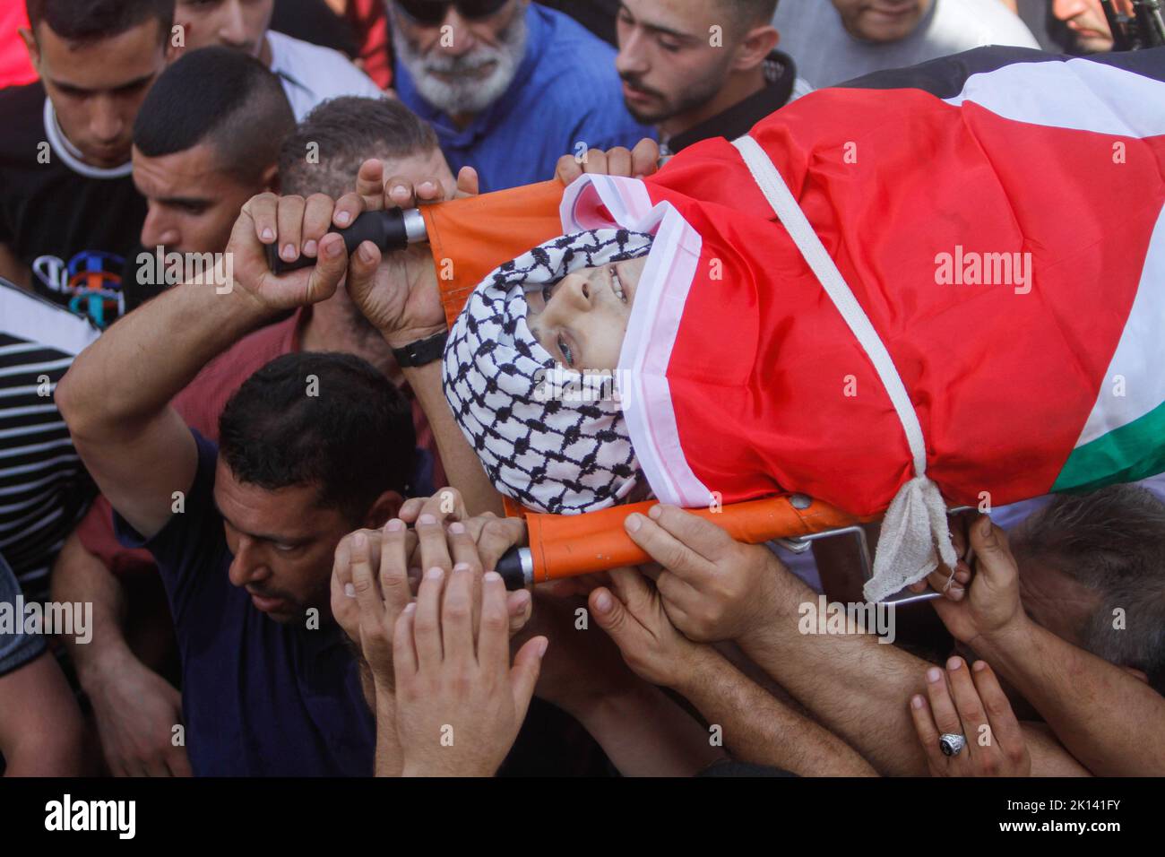 (EDITORS NOTE: Image Depicts Death)Mourners Carry The Body Of Odai ...