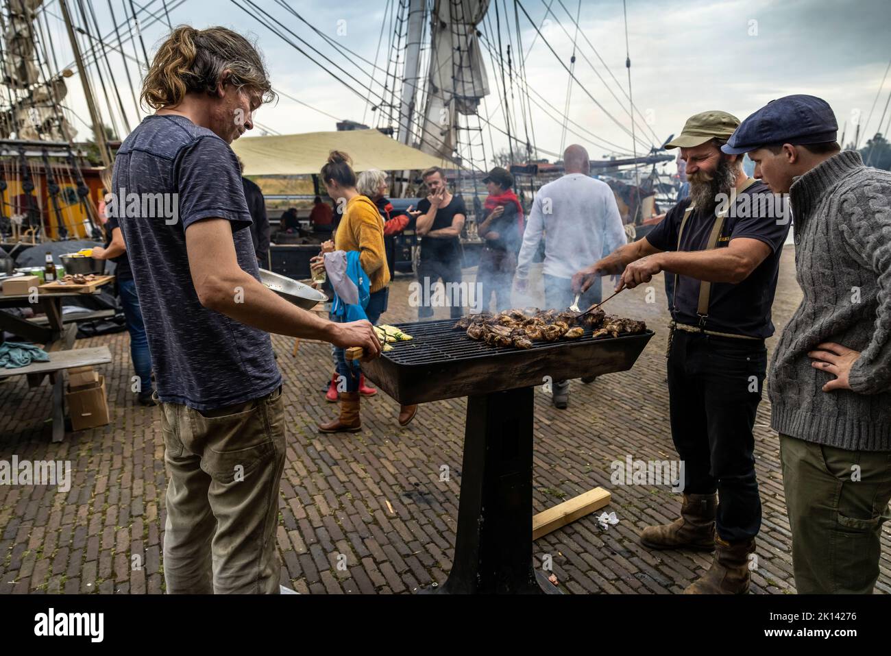 Welcome party for the crew of the 'Tres Hombres' in the home port in Den Helder. The cargo sailing vessel 'Tres Hombres' of the shipping company 'Fairtransport' has moored in its home port in Den Helder Netherlands. Here it is being prepared by the crew for its next voyage. The schooner 'Tres Hombres' transports goods such as wine, coffee, chocolate and rum from the Caribbean across the Atlantic to Europe in a completely climate-neutral manner. Stock Photo