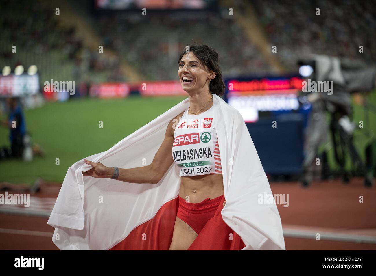 Anna Kiełbasińska with her country's flag at the European Athletics