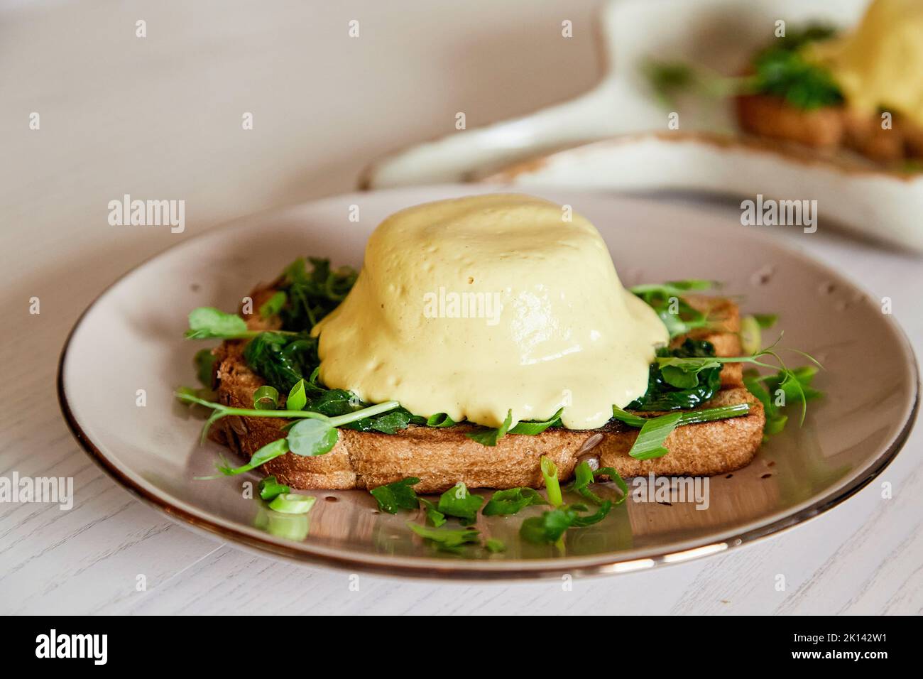 Close up of creative vegan alternative eggs benedict dish with