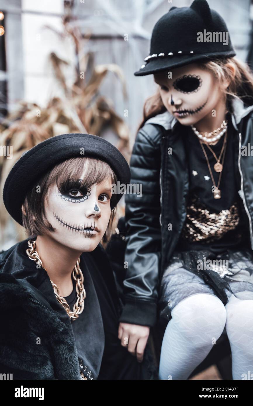 Beautiful scary little girl celebrating halloween. Terrifying black