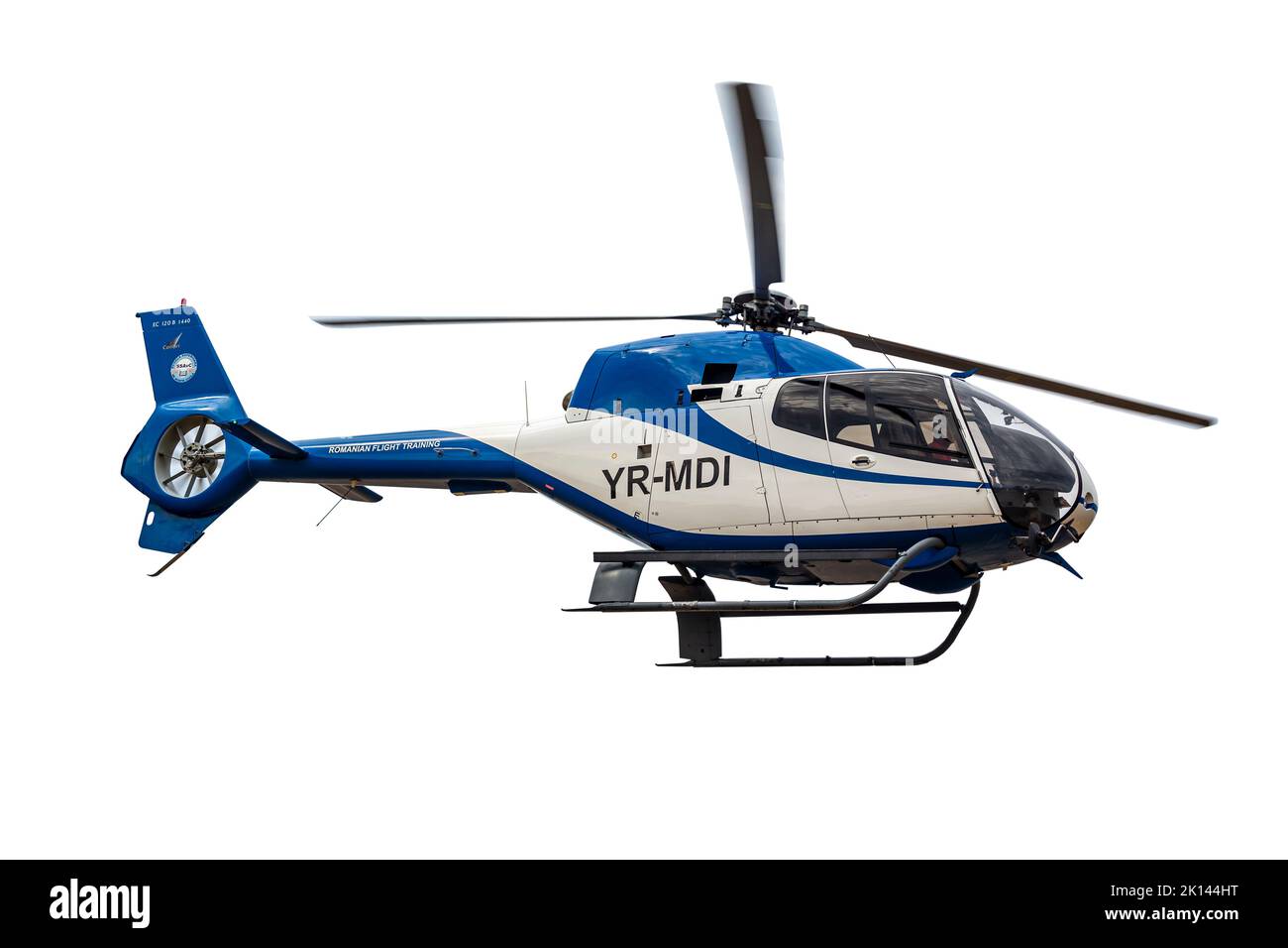 Small helicopter in flight isolated on white background. Stock Photo