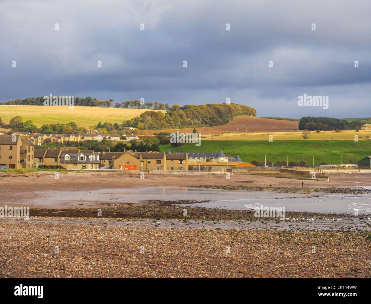 Early morning view of the small fishing town of Stonehaven, Scotland, with ominous grey clouds in the background. Stonehaven, is a Scottish coastal to Stock Photo