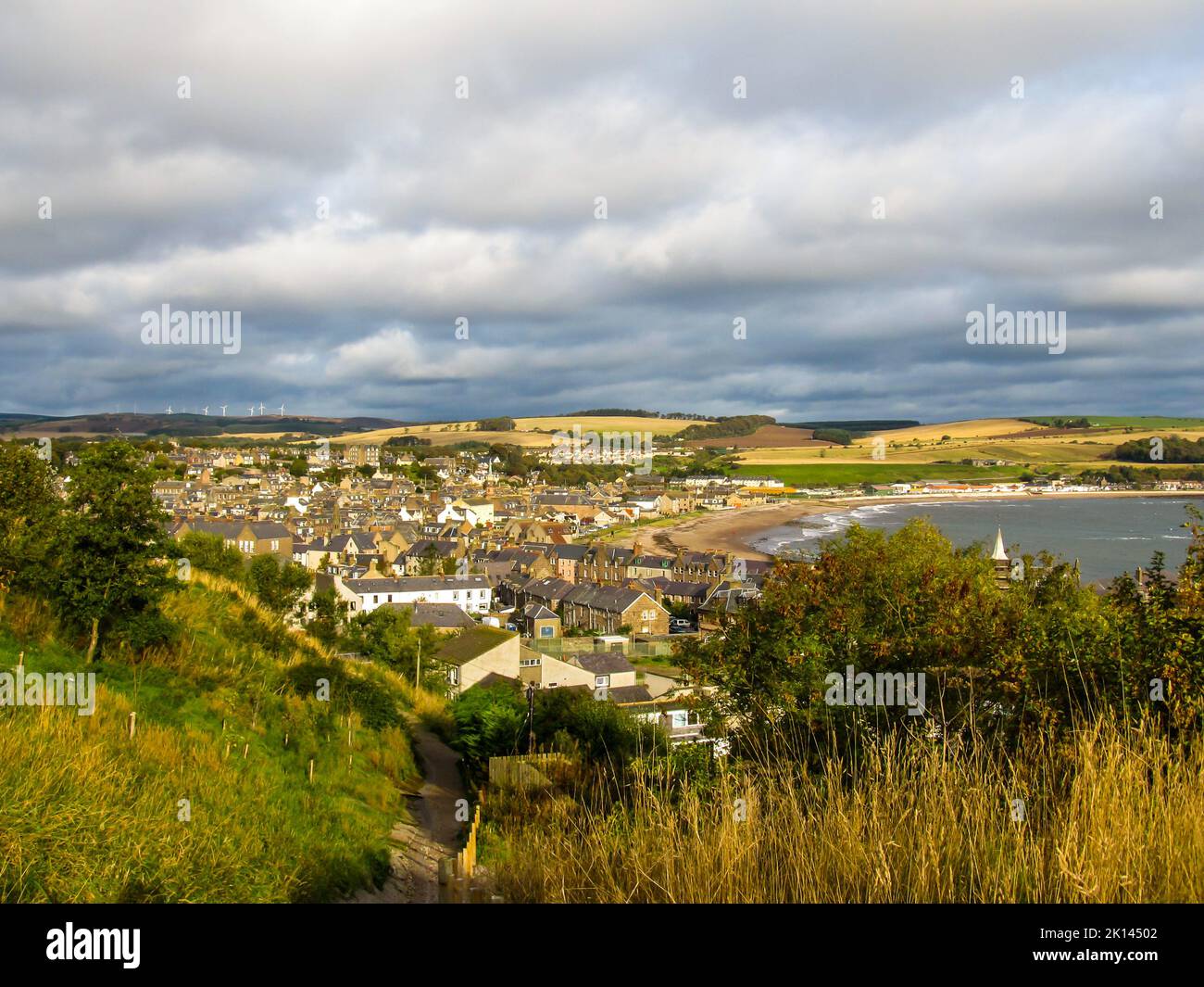Picturesque view of the Scottish fishing village of Stonehaven, with a dramatic stormy sky in the background. Stone Haven, is a Scottish coastal town Stock Photo