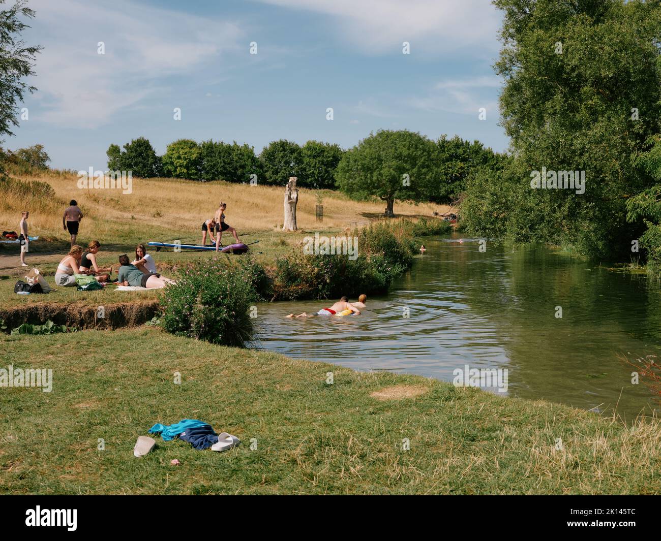 Summer swimming in Grantchester Meadows on the River Cam in Cambridge Cambridgeshire England UK - summertime countryside people swimmers Stock Photo