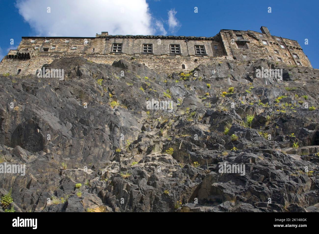 edinburgh castle perched high above the city on a granite cliff Stock Photo