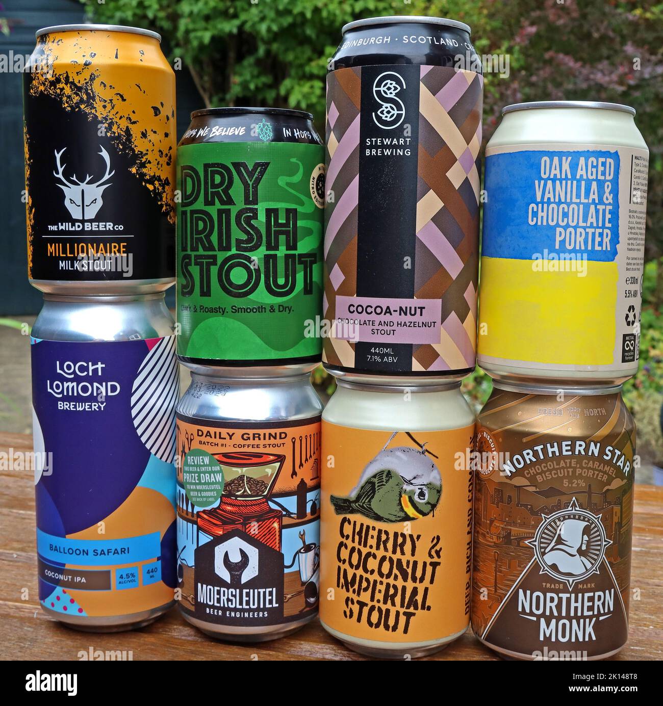 A mixture of craft canned beers, with unusual ingredients, coconut, cherry, caramel, coffee, chocolate, vanilla, hazelnut stouts and porters Stock Photo